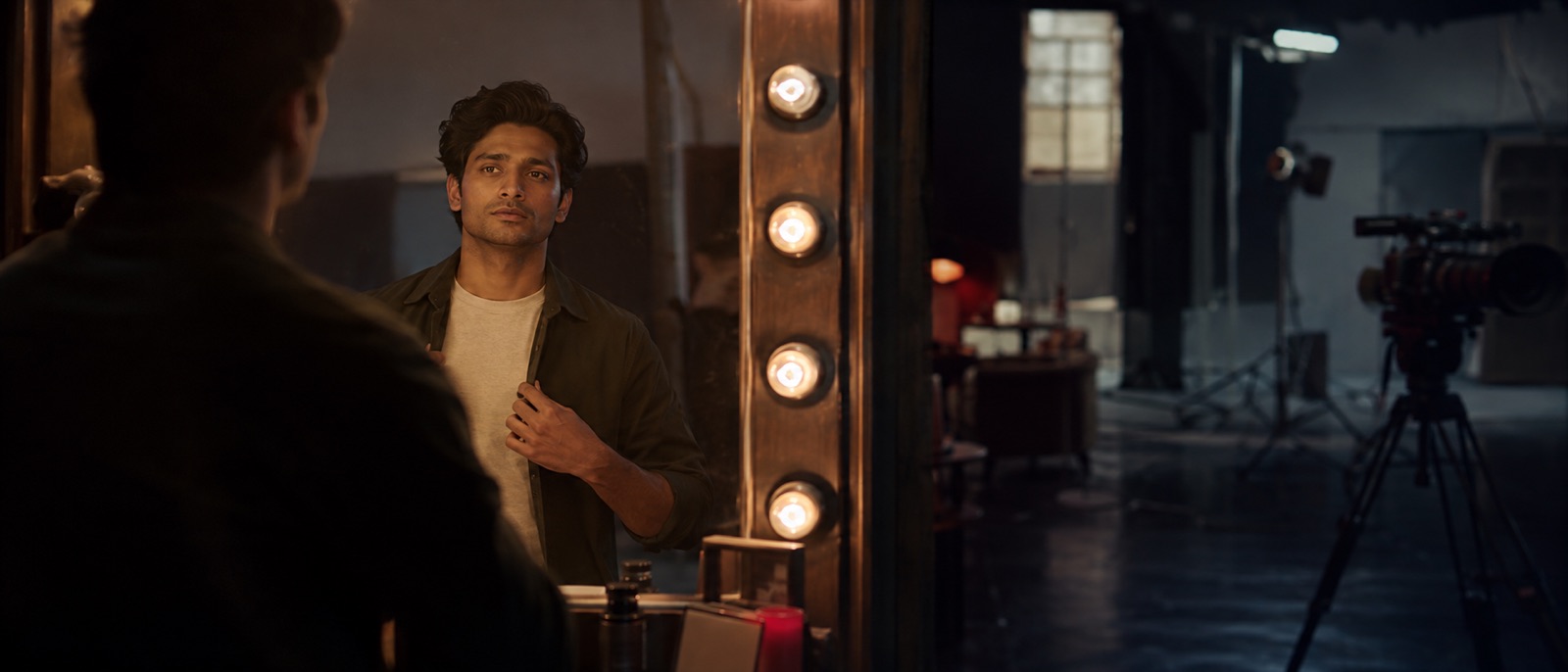 Aspiring actor preparing with confidence before a studio shoot